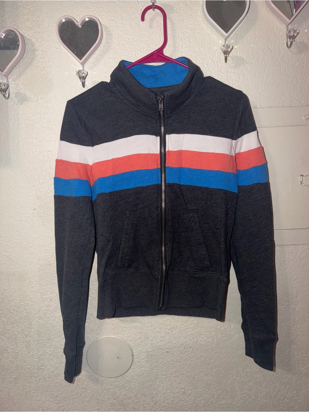 Hollister Black Zip-Up Jacket with White, Coral, and Blue Stripes